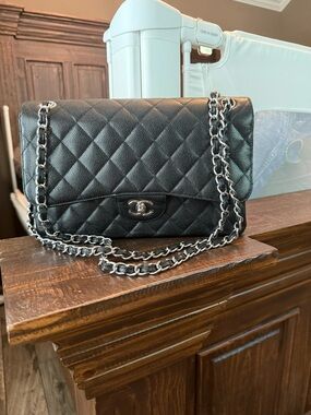 CHANEL Black Quilted Flap Shoulder Bag with Silver Chain